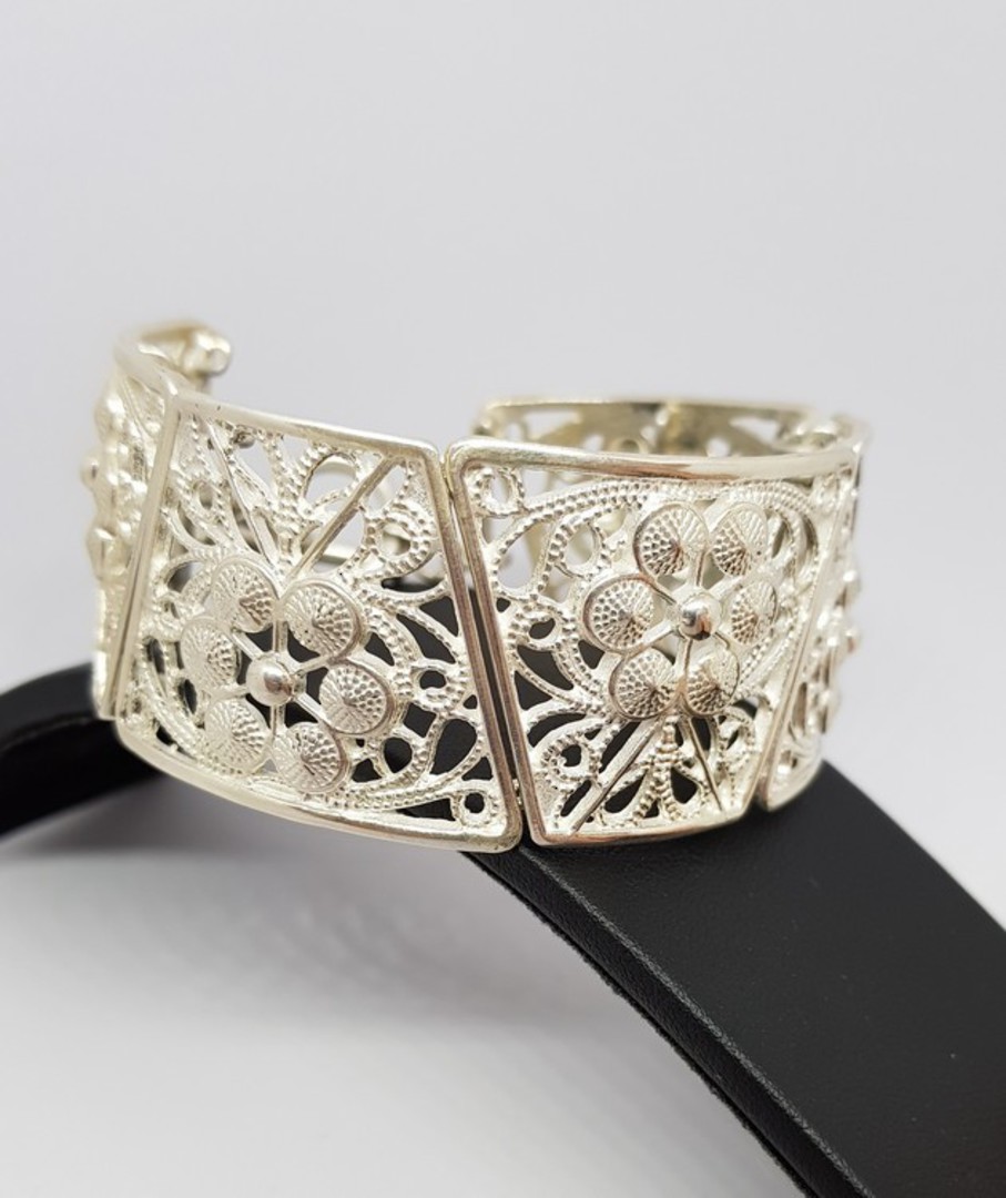 Chunky silver NZ made bracelet with carved flowers and swirls image 1
